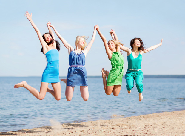 happy friends on beach