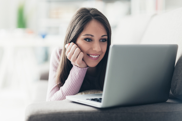 Girl watching movies on a computer HD picture